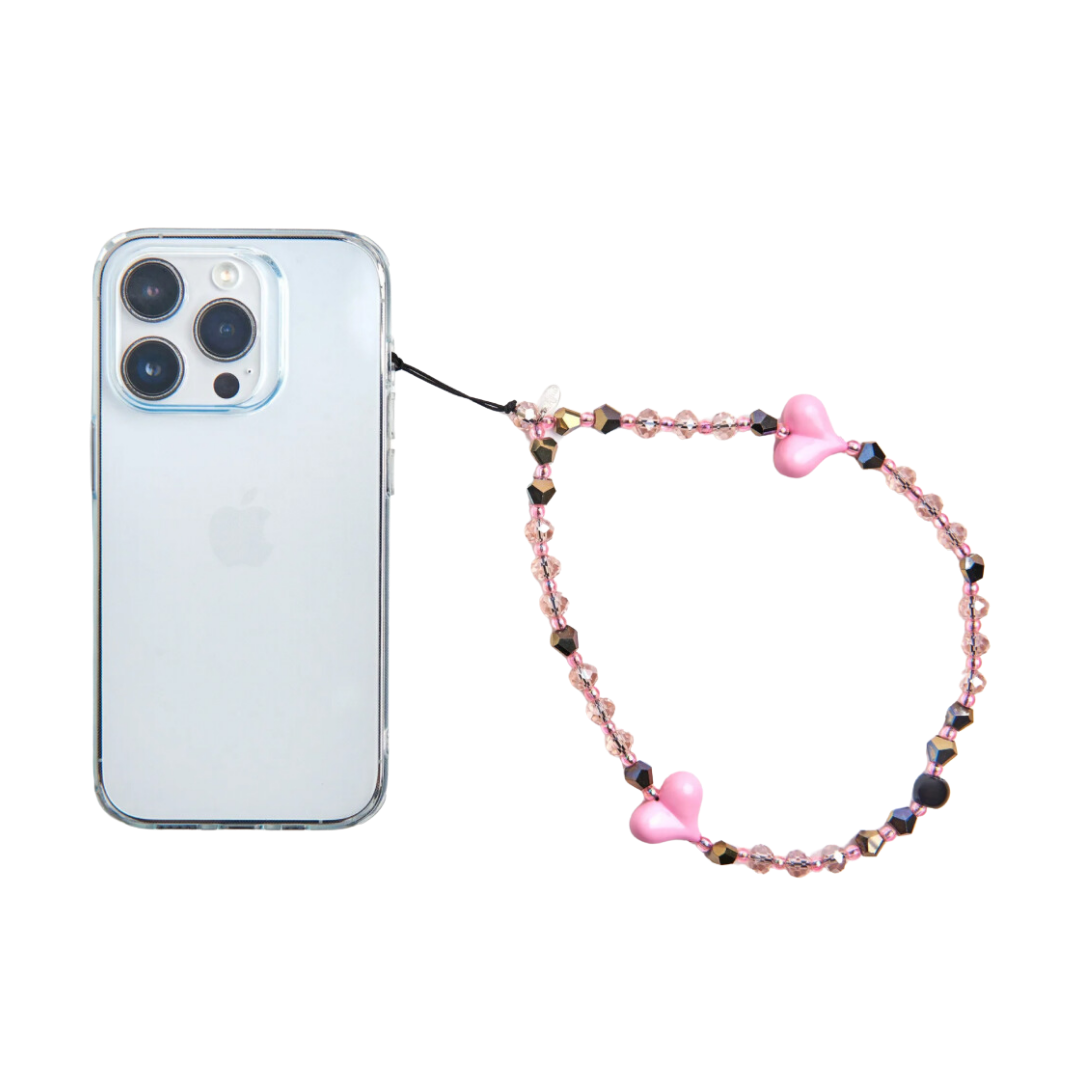 phone charm with pink crystals and hearts attached to phone