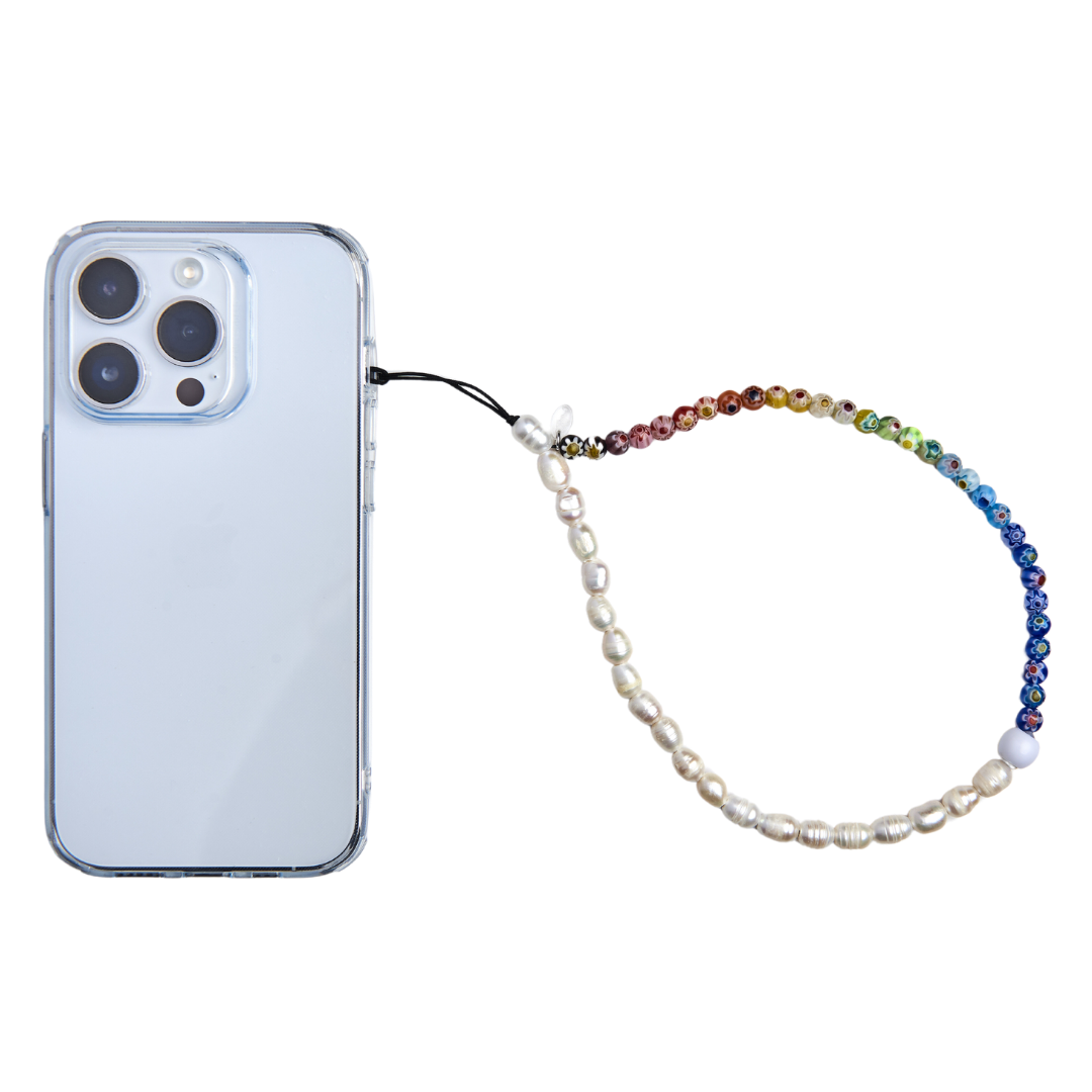 Phone with phone charm with pearls and flowers